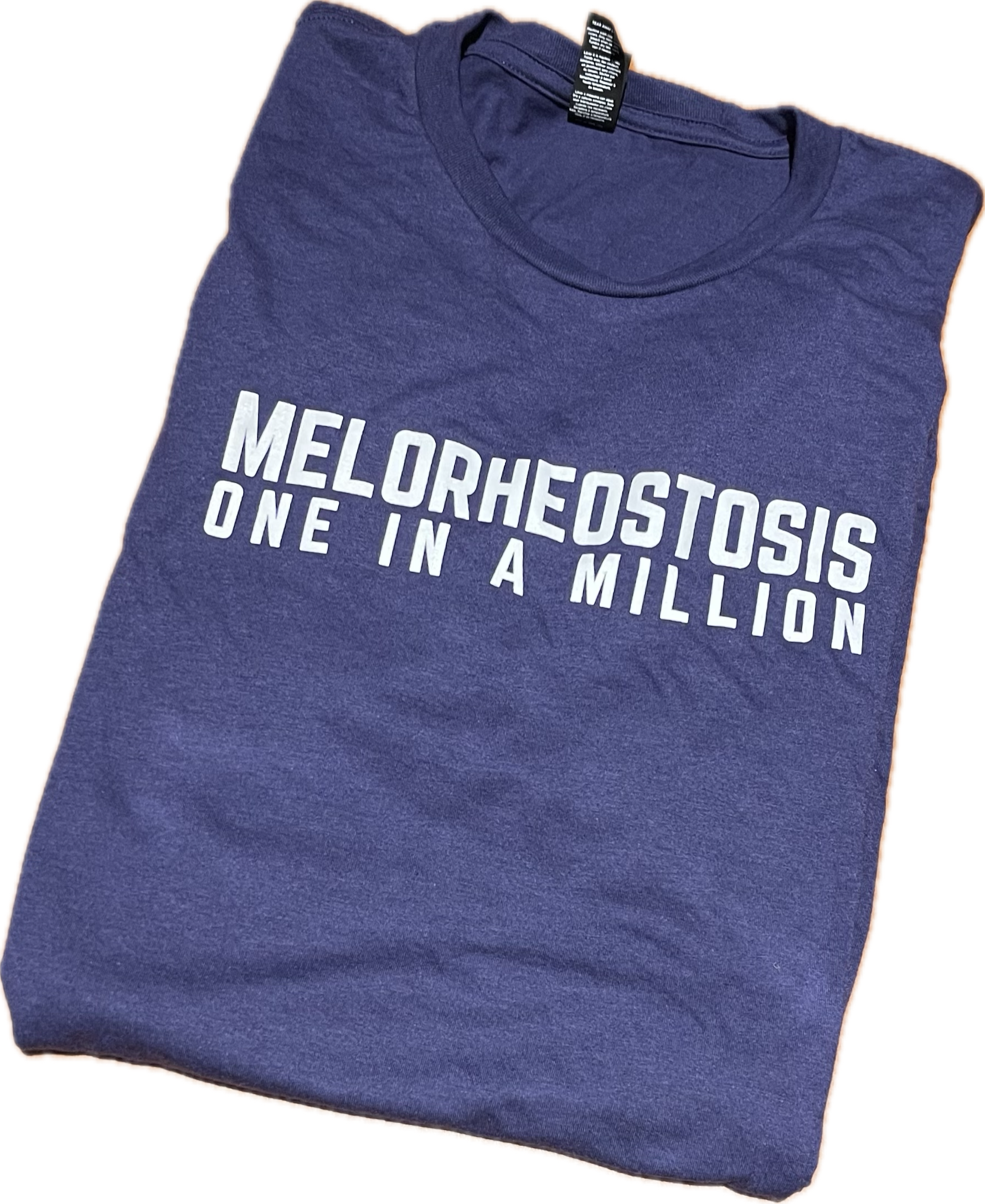 dark blue t-shirt with Melorheostosis one in a million written in white all caps letters